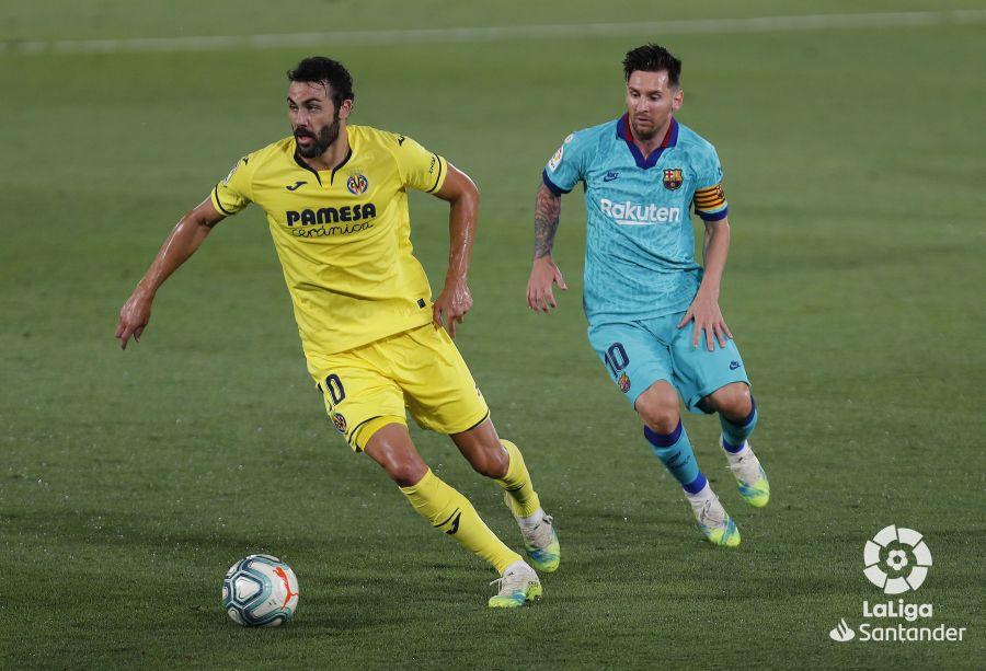 Vicente Iborra y Leo Messi