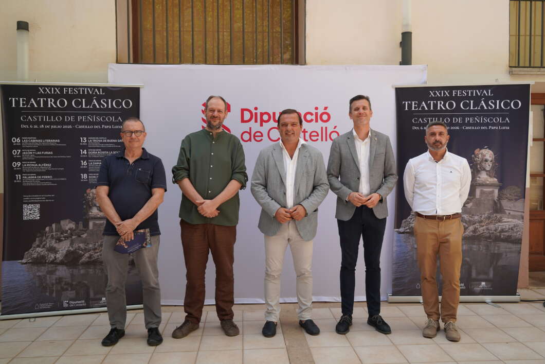 Five men stand in a row posing for a photo at a cultural festival, with Teatro Clásico banners on either side and a central Diputació de Castelló backdrop.