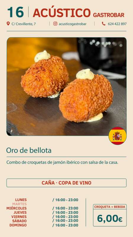 Two golden croquettes with a dab of sauce on a dark plate, representing the Oro de bellota dish at Acústico Gastrobar.